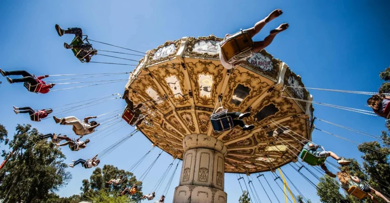 Gold Mine Tours in Johannesburg: Go Underground Where the Gold Rush Began Riders on the Wave Swing ride at Gold Reef City in Johannesburg