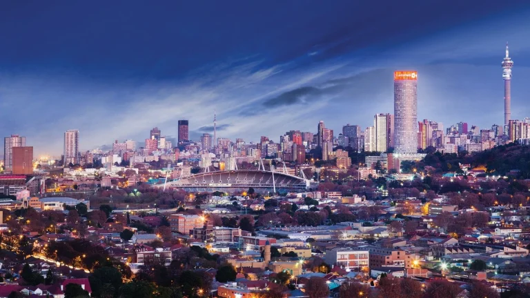 Where Is Gauteng? A Guide to South Africa’s Smallest Province Johannesburg skyline at dusk with Ellis Park Stadium, Ponte City and the Hillbrow Tower