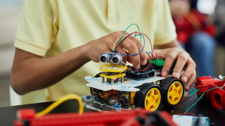 Boy Playing with an Electronic Toy Car