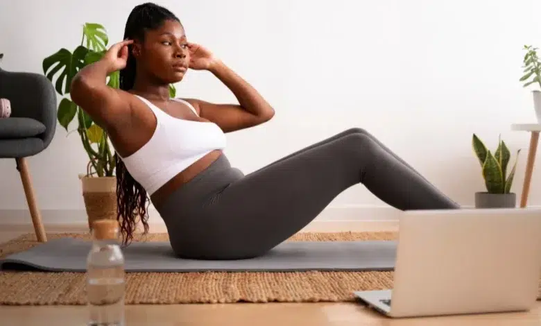 Full shot woman training with laptop