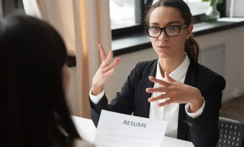 Lady sitting in an interview and answering questions
