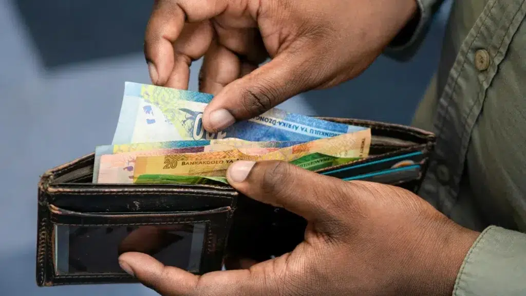 Man Hands Holding Wallet and Cash - South African Rand
From - Pexels