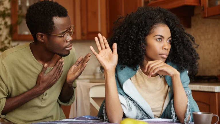 Please forgive me. Unhappy African American male cheater holding hand on chest