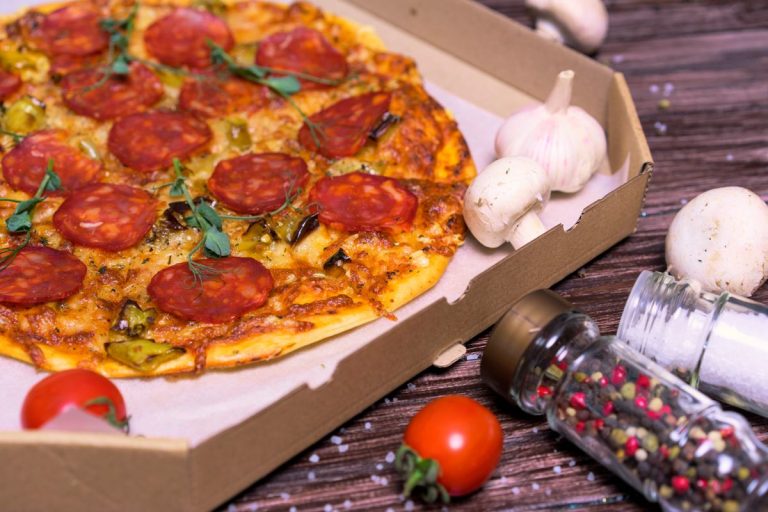 Roman’s Pizza Menu: What’s on It in 2026 Pepperoni pizza in a takeaway box