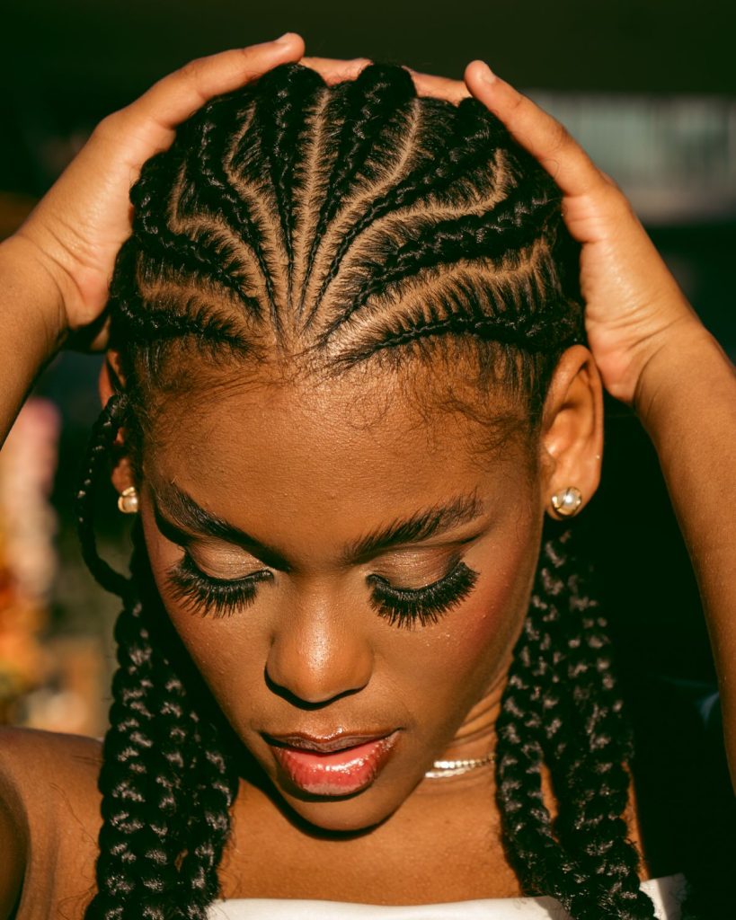 Woman wearing straight-back cornrows
