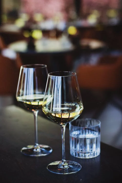 Close Up Photo of Glasses of Wine - Pexels Kristina Paukshtite