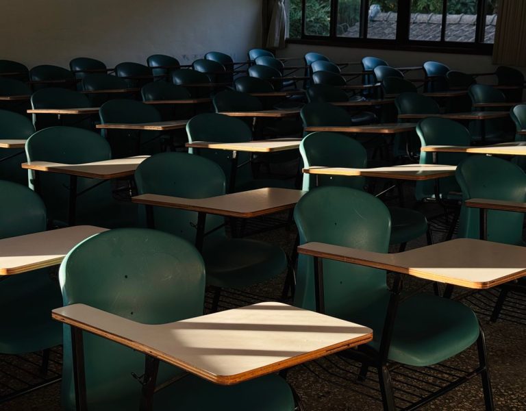 Empty classroom with desks and chairs