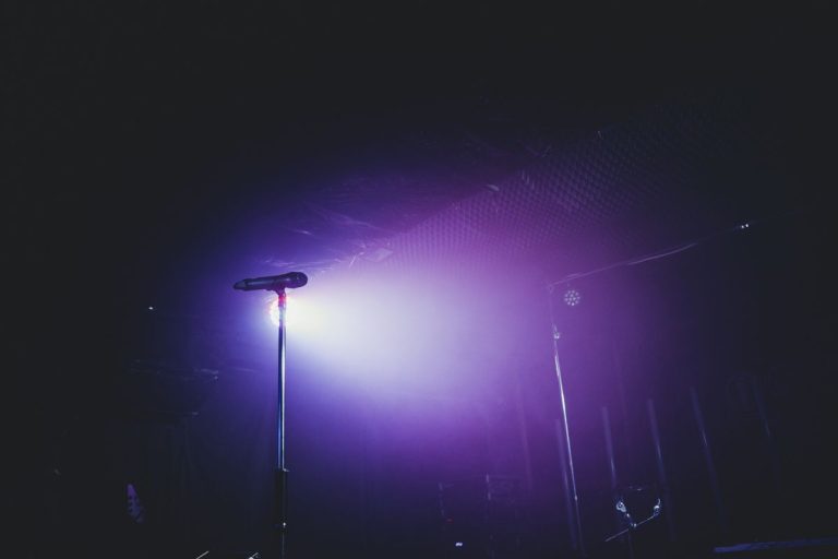 Rebecca Malope: Her Journey, Music, and Impact on SA Gospel Microphone on a stage in purple light