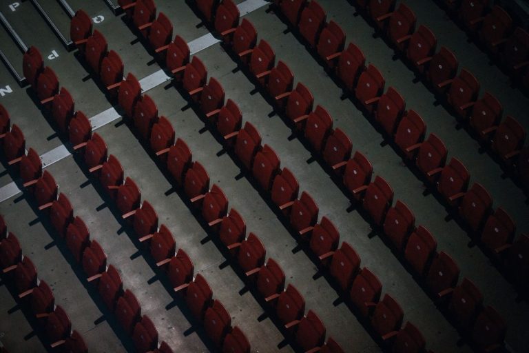 Bafana Bafana’s World Cup Dream at Risk: Who Will Be Held Accountable? Rows of empty red stadium seats from above