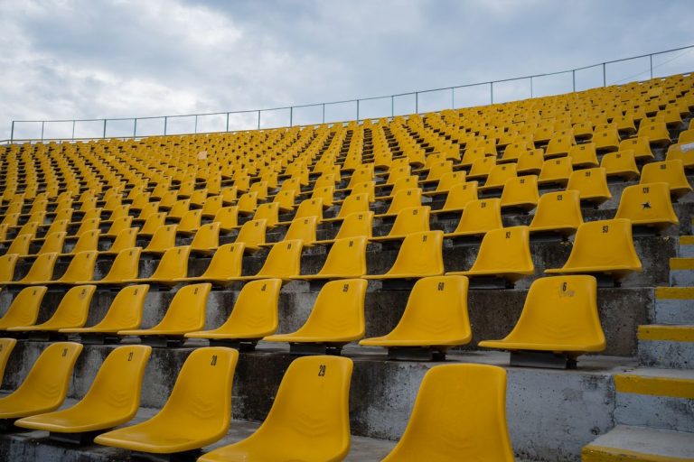 Jessica Motaung Breaks New Ground in FIFA Men’s Football Governance Rows of empty yellow stadium seats