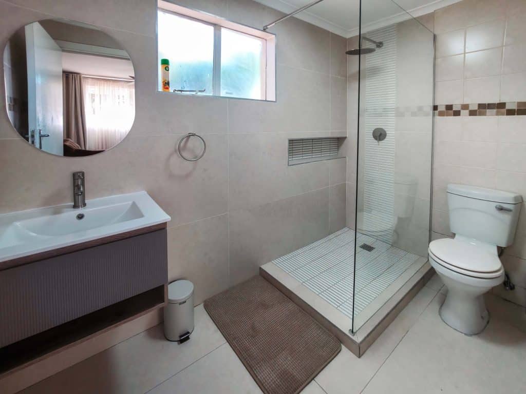 En-suite bathroom with walk-in shower at Tau Golden Mane Guest House