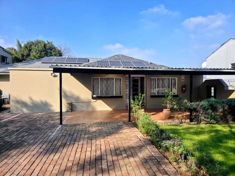 Tau Golden Mane Guest House exterior and covered parking, Highlands North